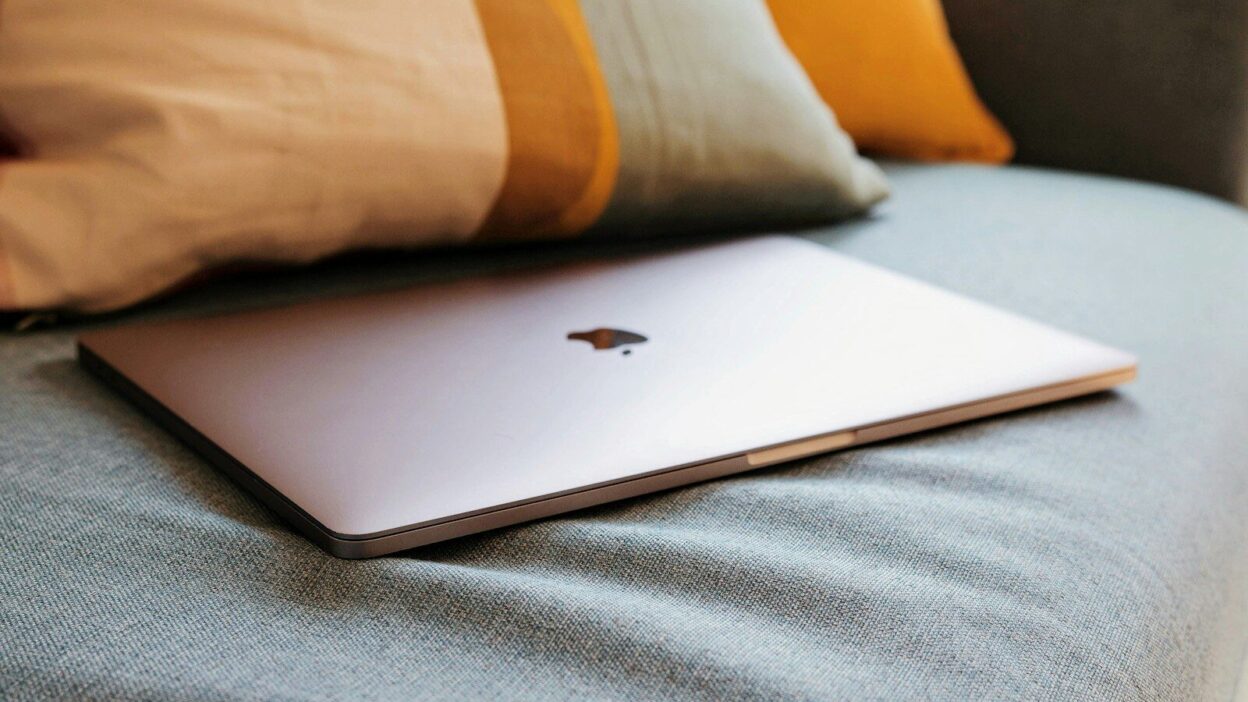 macbook air on gray textile