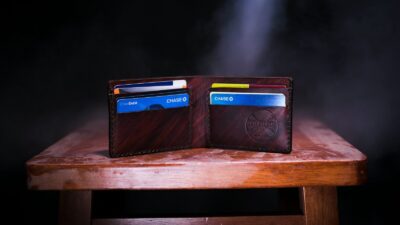 brown leather bifold wallet on table